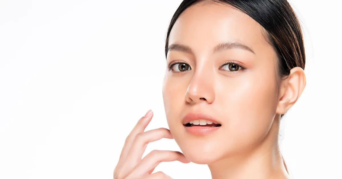 Close-up of a client receiving a skin resurfacing treatment (like DiamondGlow) with a device that cleanses and infuses the skin